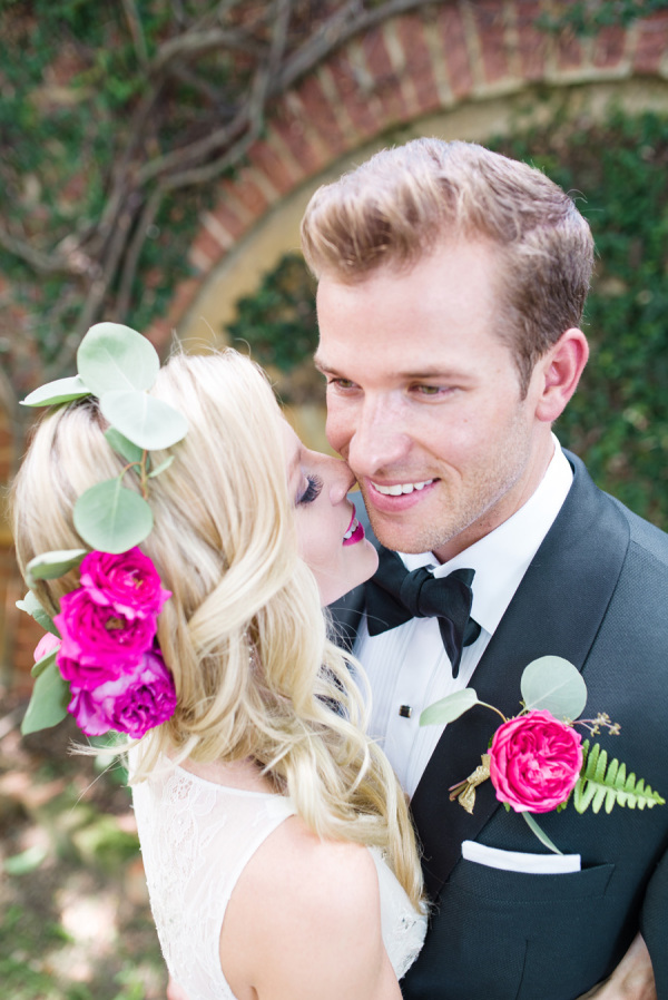 Amazing wedding hairstyle with big hot pink roses. 