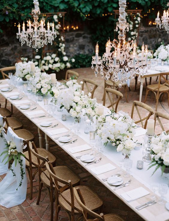Beautiful table setting for an outside white wedding