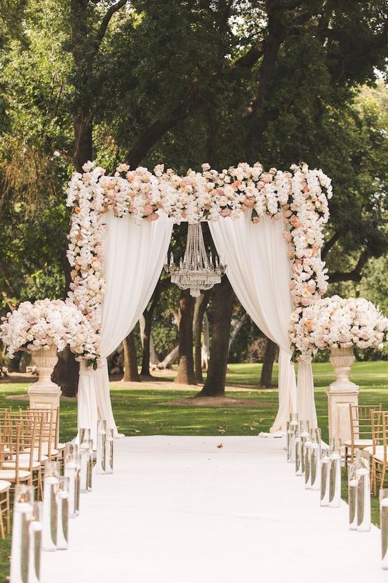 Beautiful floral arbor for a white wedding
