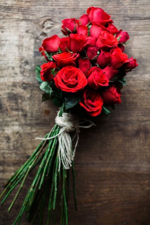 Long stemmed red roses with a simple tie. Gorgeous!