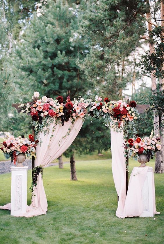  How gorgeous is this marsala pink wedding arch!? This is something that would work really well for an indoor Fall or Winter wedding too. 